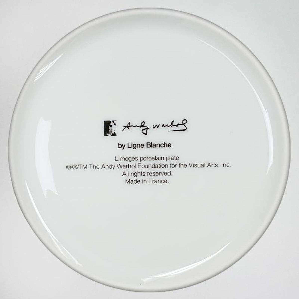 Andy Warhol (1928-1987), "SKULL (Yellow/Pink)" Framed Limoges Porcelain Plate.