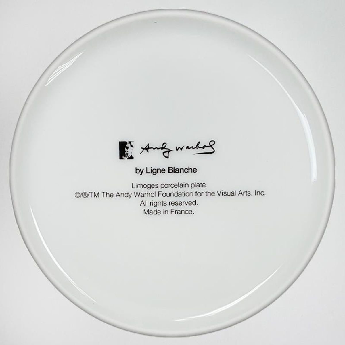 Andy Warhol (1928-1987), "SKULL (Beige)" Framed Limoges Porcelain Plate.